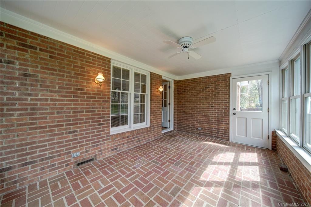 1415 Melchor Road Albemarle, NC 28001 - Photo 44 of 47 a view of a brick house with many windows