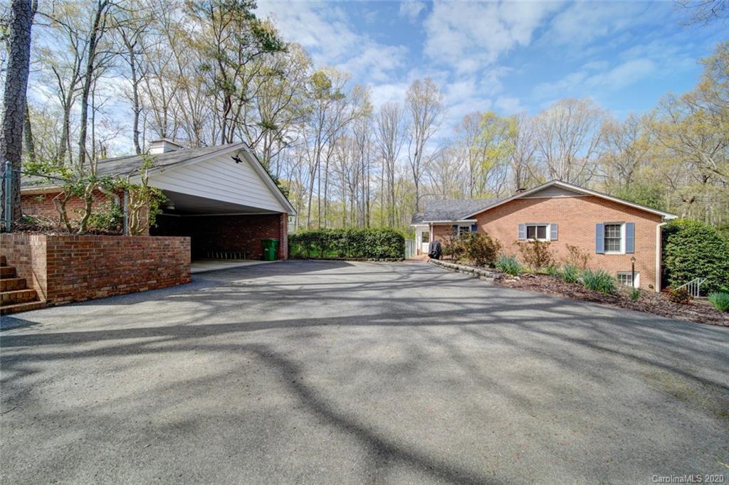 1415 Melchor Road Albemarle, NC 28001 - Photo 6 of 47 a house with trees in front of it