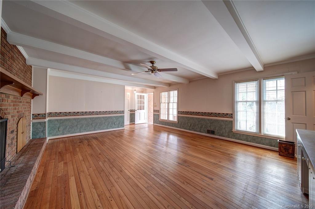 1415 Melchor Road Albemarle, NC 28001 - Photo 9 of 47 a view of an empty room with wooden floor and a window