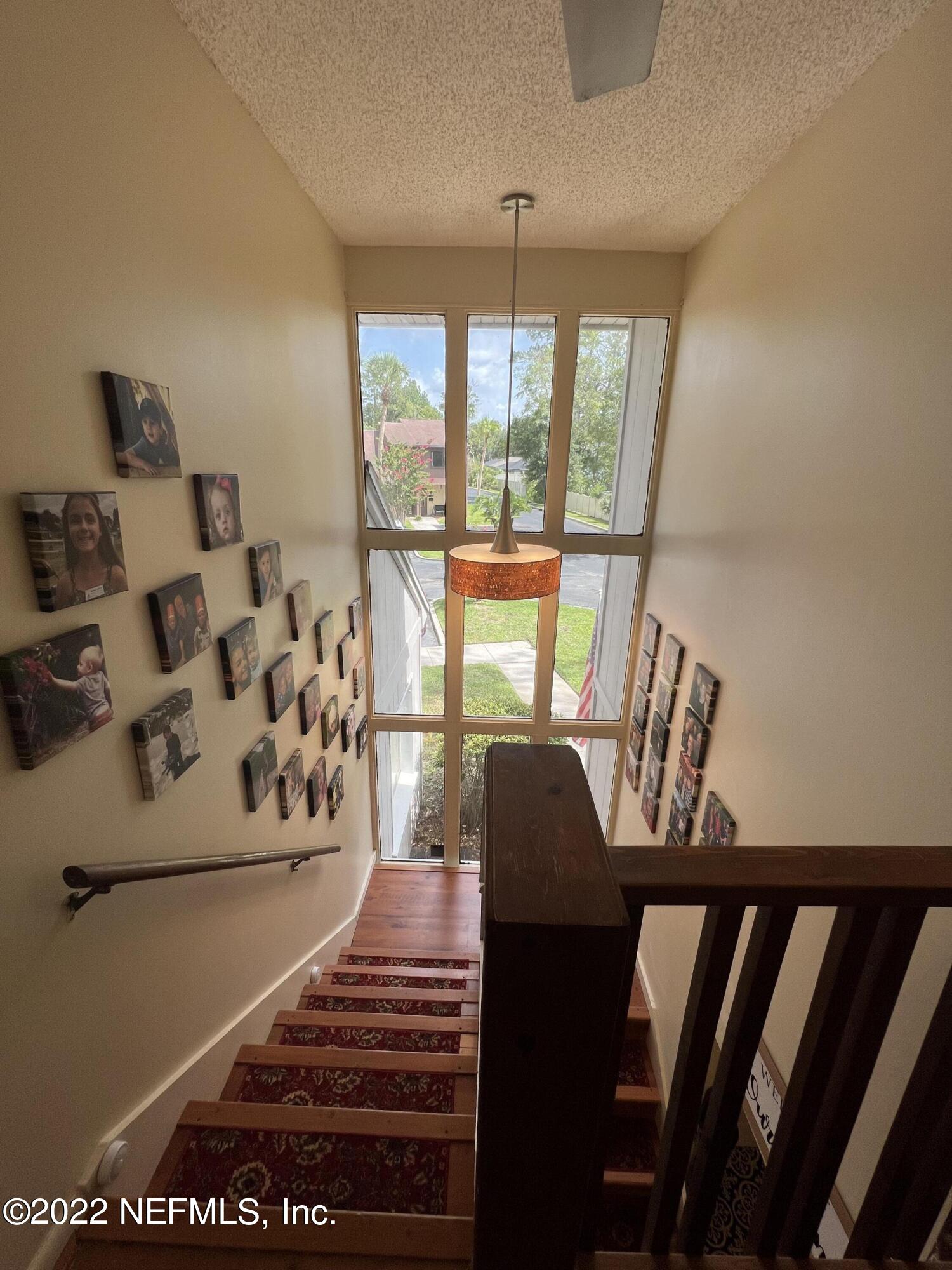 7122 Cypress Cove Road, Unit 47 Jacksonville, FL 32244 - Photo 18 of 24 a view of a living room and balcony