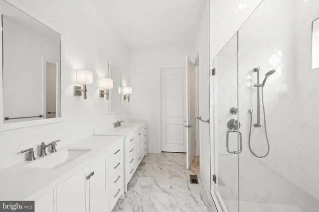 a bathroom with a double vanity sink mirror and double