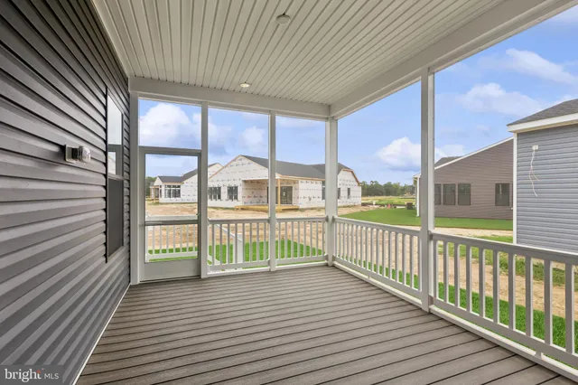 a view of a balcony with wooden floor