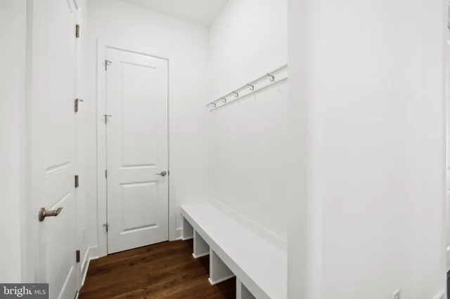 a view of room with wooden floor