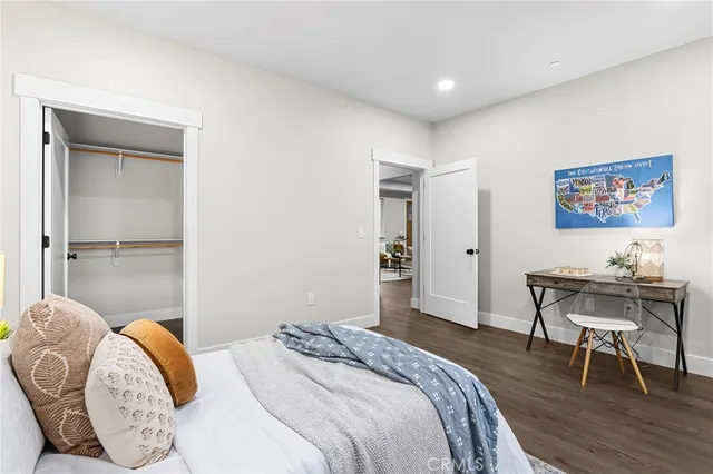 a bedroom with a bed and a table in it