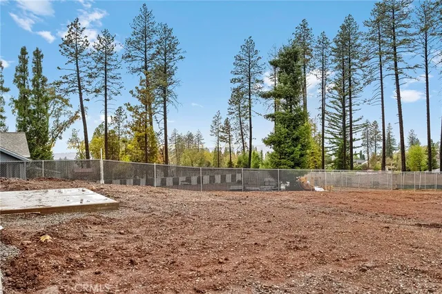 an aerial view of residential houses with city view