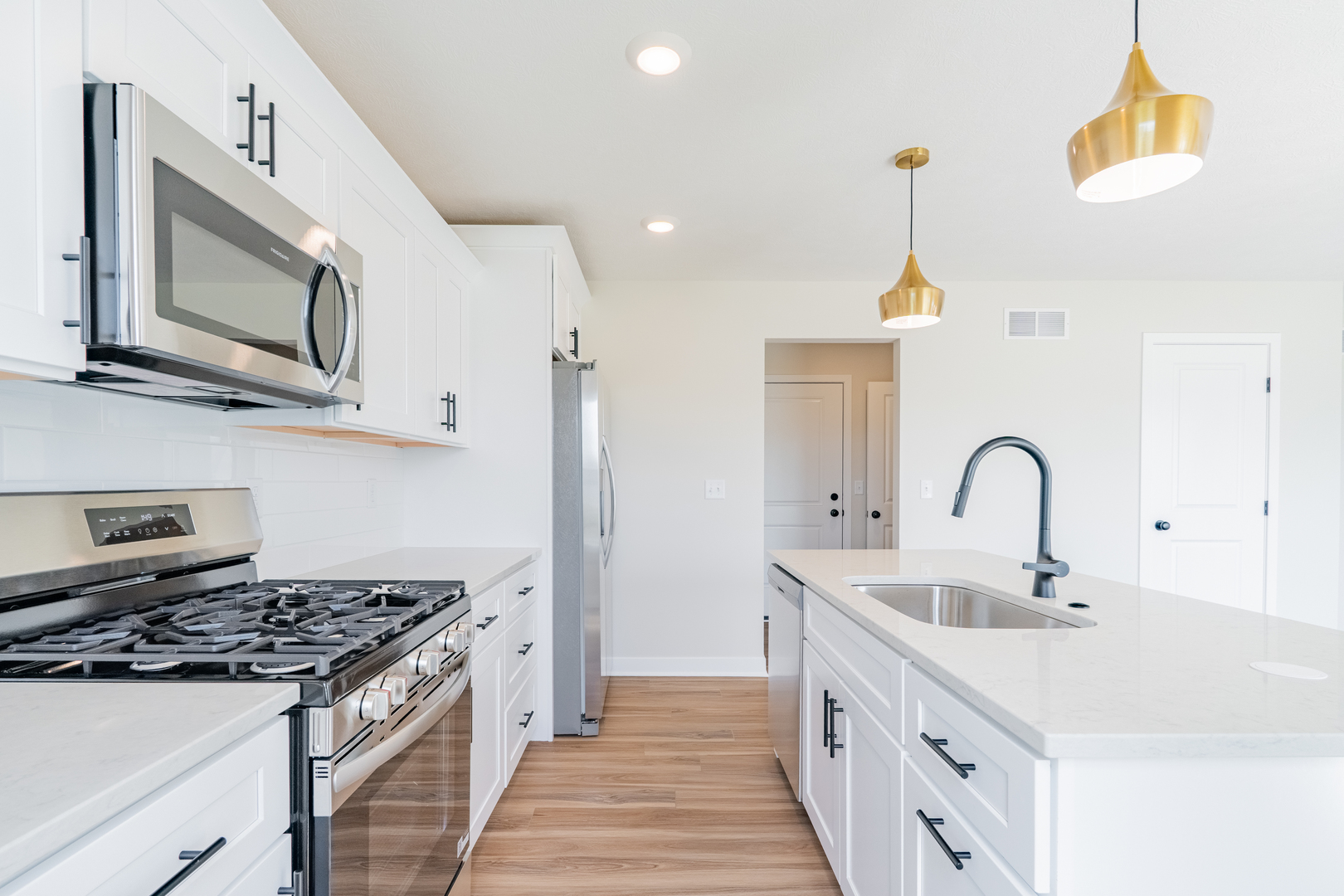 503 Wild Turkey Lane Normal, IL 61761 - Photo 13 of 34 a kitchen with stainless steel appliances granite countertop a stove and a sink