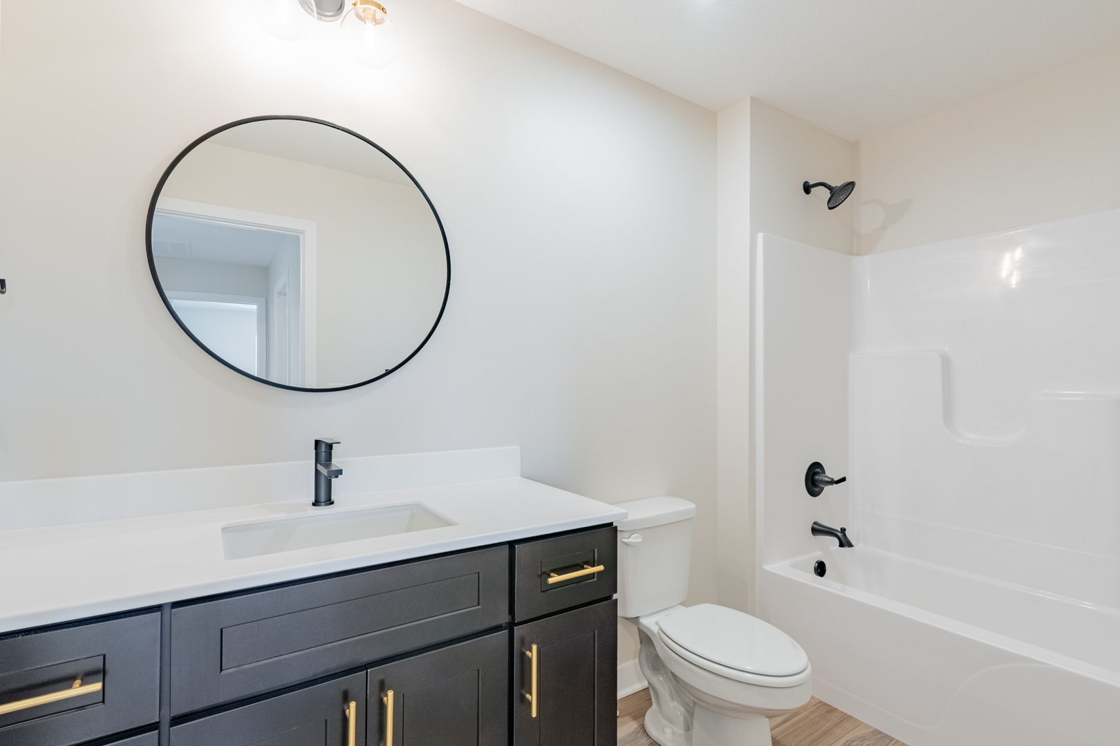 503 Wild Turkey Lane Normal, IL 61761 - Photo 22 of 34 a bathroom with a sink a toilet and a mirror