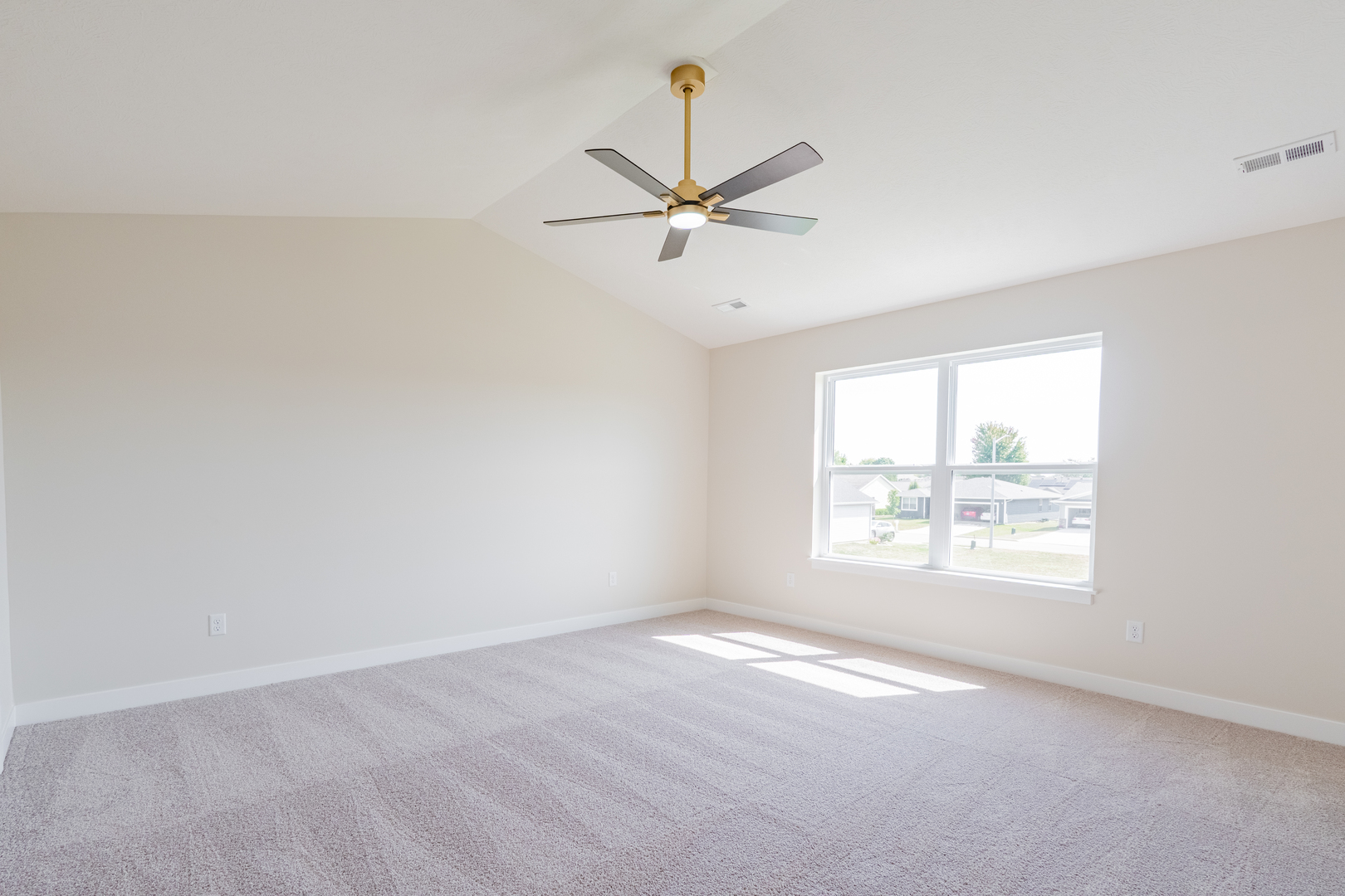 503 Wild Turkey Lane Normal, IL 61761 - Photo 23 of 34 an empty room with a window and a fan