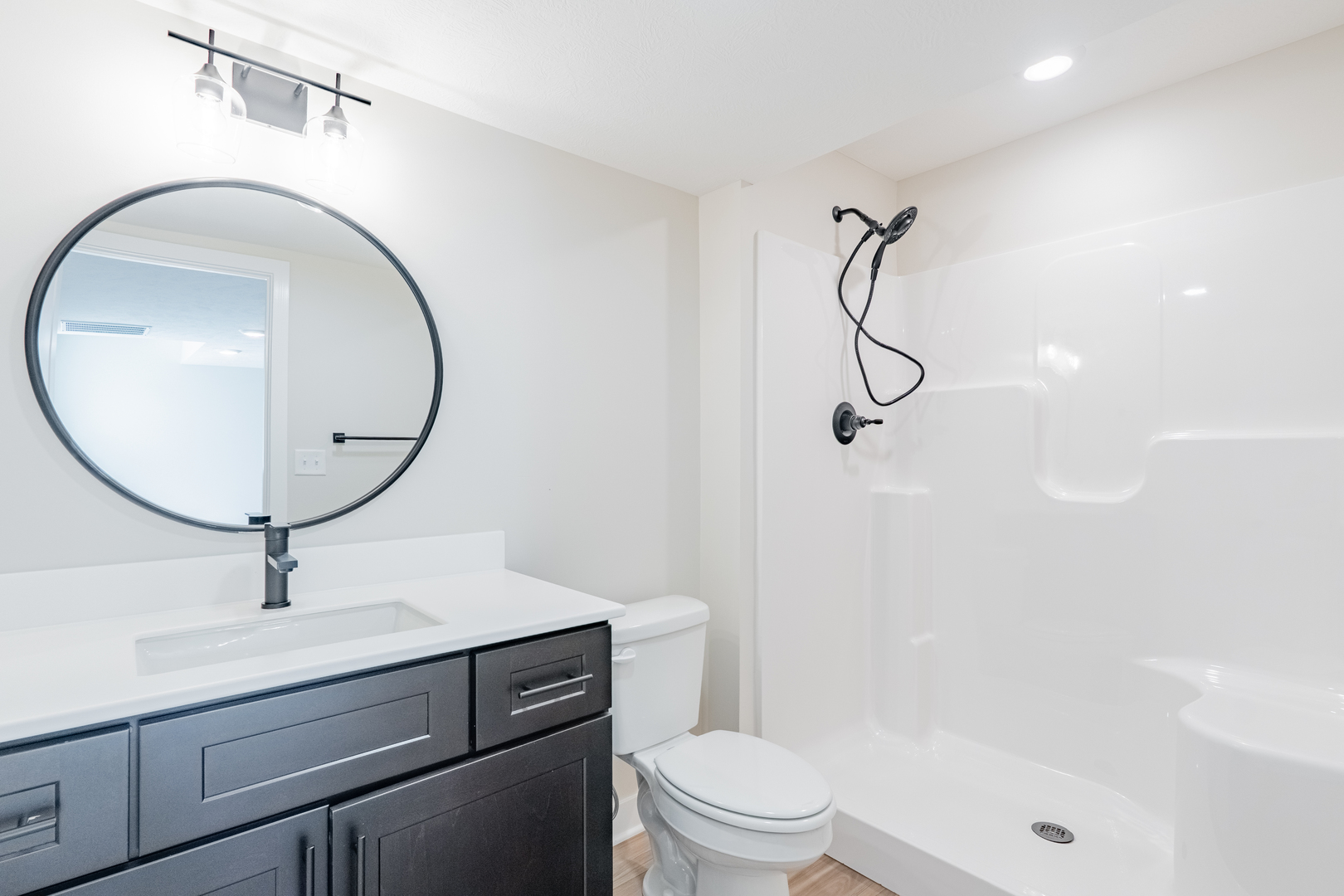 503 Wild Turkey Lane Normal, IL 61761 - Photo 28 of 34 a bathroom with a sink a toilet and a mirror