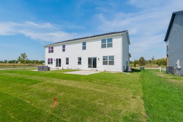 a view of house with backyard