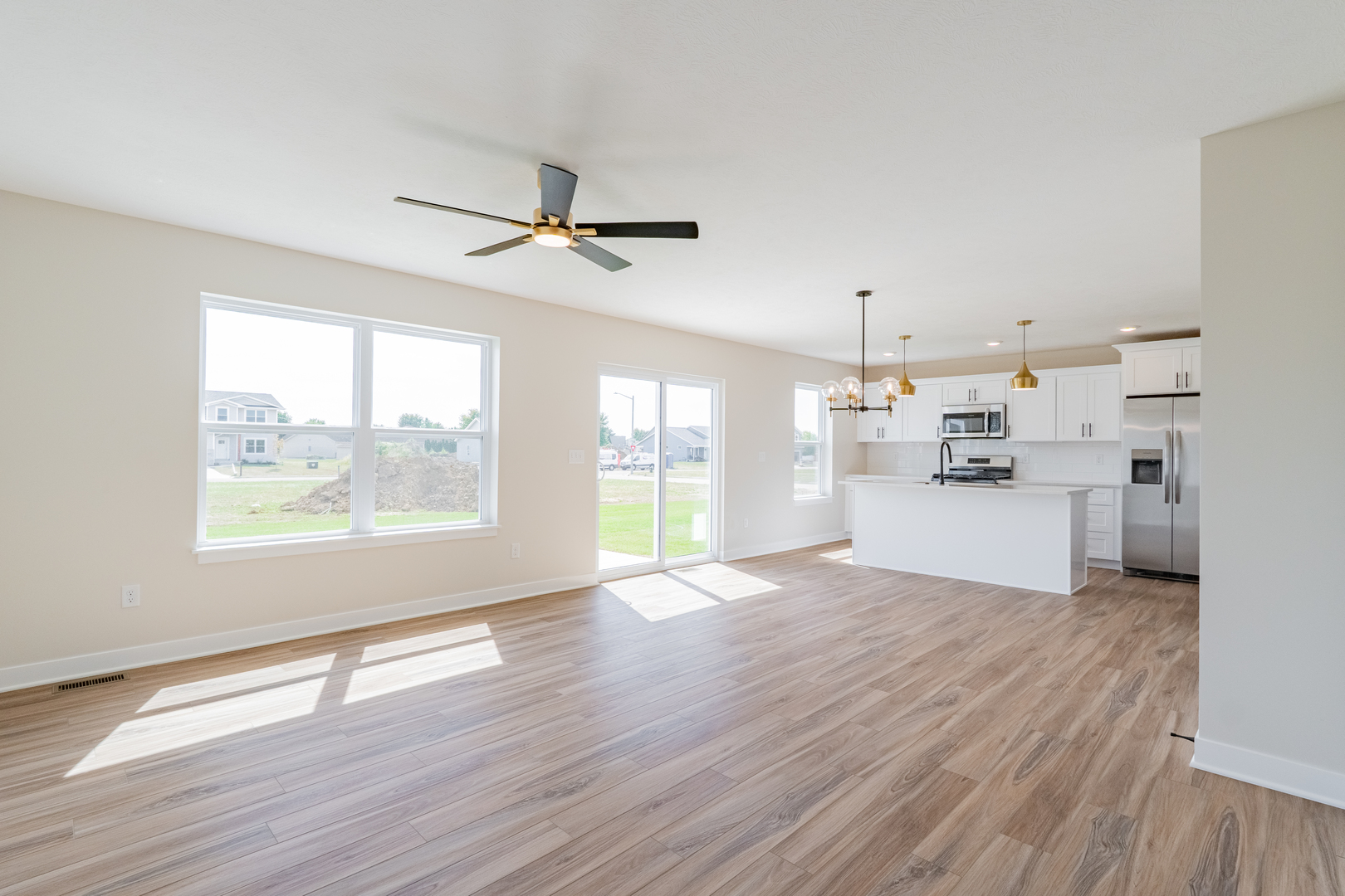 503 Wild Turkey Lane Normal, IL 61761 - Photo 5 of 34 a view of an empty room with wooden floor and a window