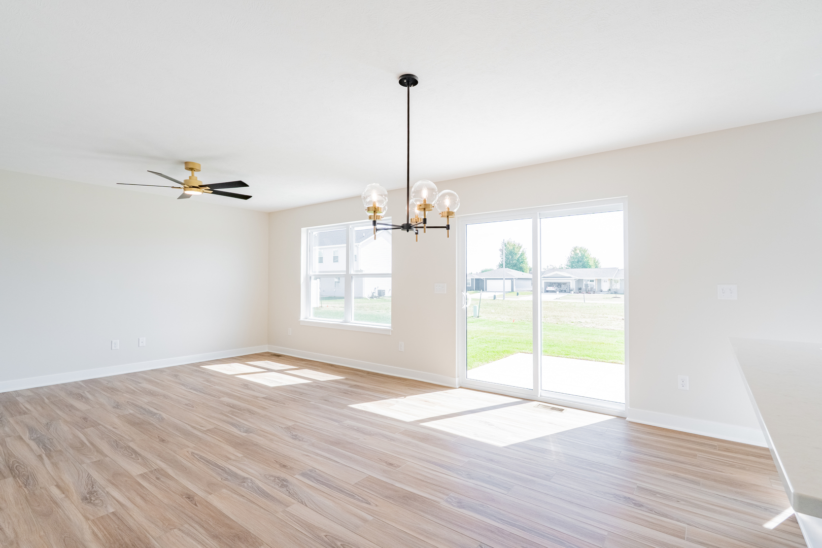 503 Wild Turkey Lane Normal, IL 61761 - Photo 9 of 34 a view of a room with wooden floor fan and a window