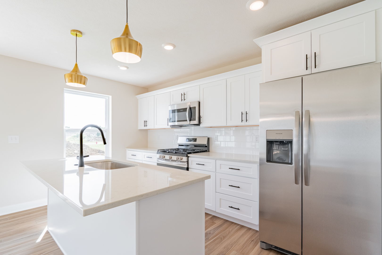 503 Wild Turkey Lane Normal, IL 61761 - Photo 10 of 34 a kitchen with white cabinets and refrigerator
