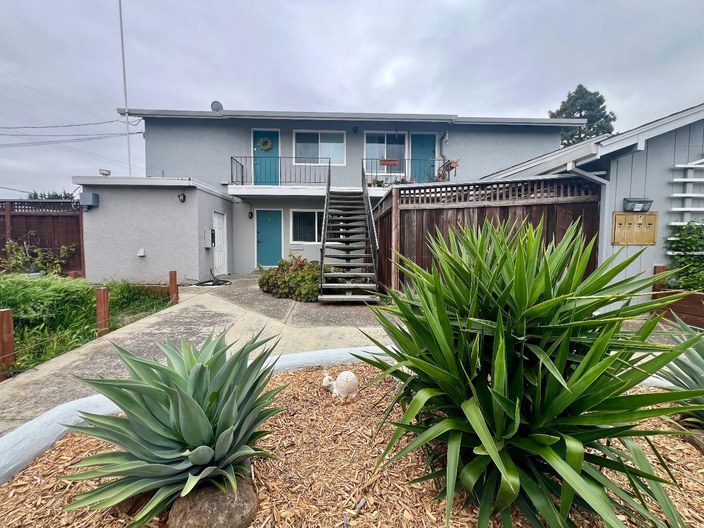 164 Echo Avenue, Unit 2 Campbell, CA 95008 - Photo 1 of 1 a front view of a house with a plant in a patio