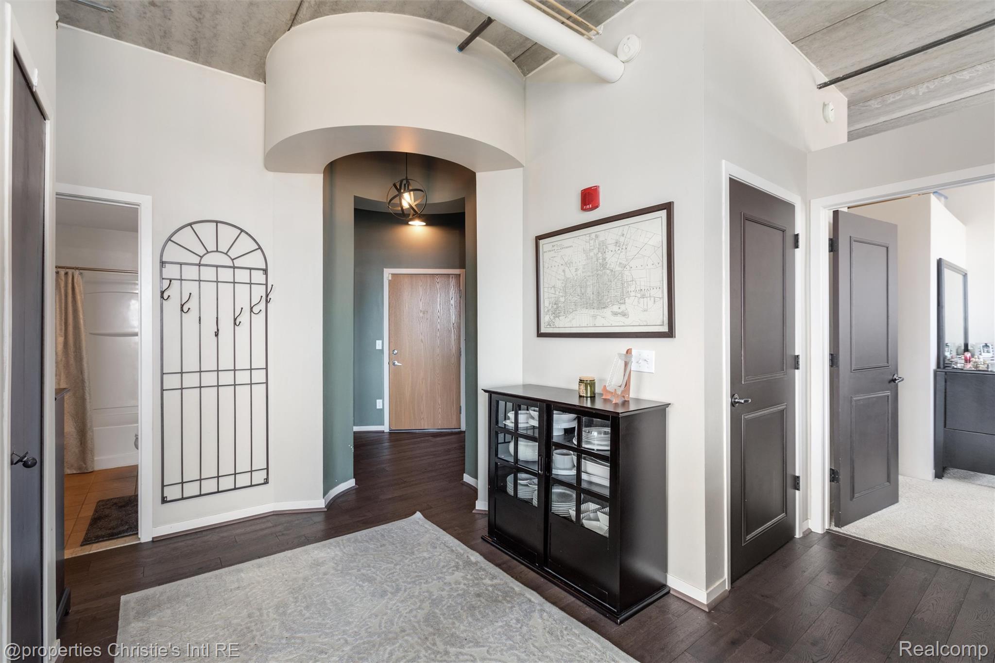 66 Winder Street, Unit 332 Detroit, MI 48201 - Photo 25 of 30 Entryway with dark wood-type flooring and arched walkways