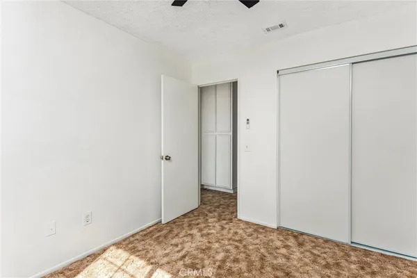 a view of a big room with closet and cabinet