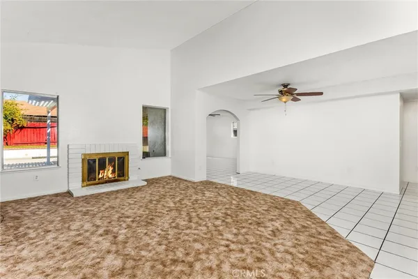 a view of empty room with a fireplace