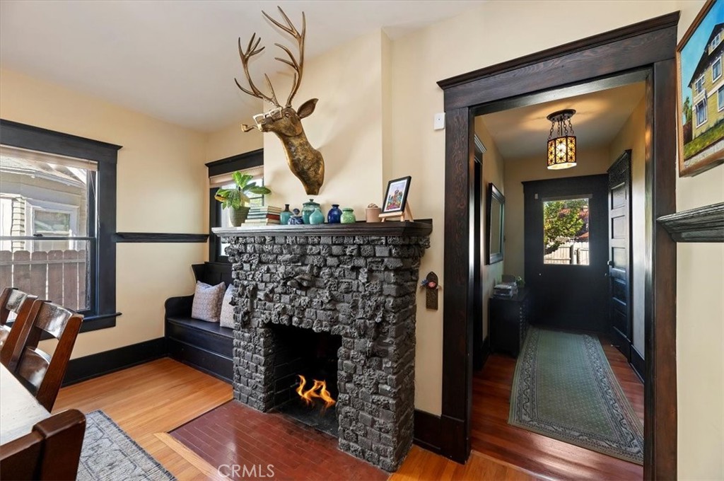 4161 University Riverside, CA 92501 - Photo 19 of 52 a living room with furniture a fireplace and a chandelier