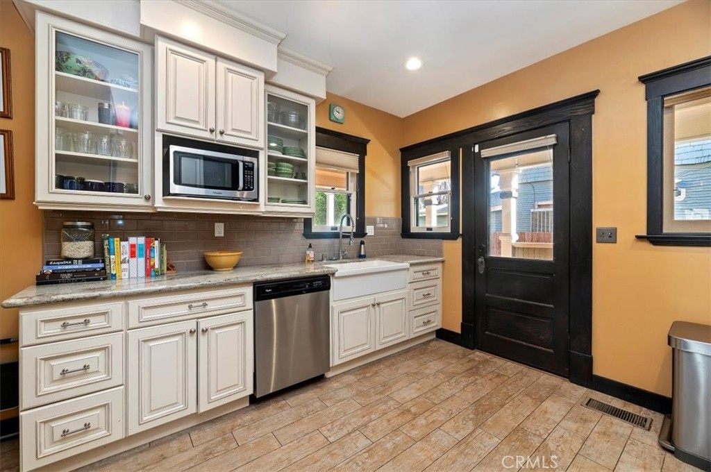 4161 University Riverside, CA 92501 - Photo 20 of 52 a kitchen with stainless steel appliances granite countertop a stove and a sink