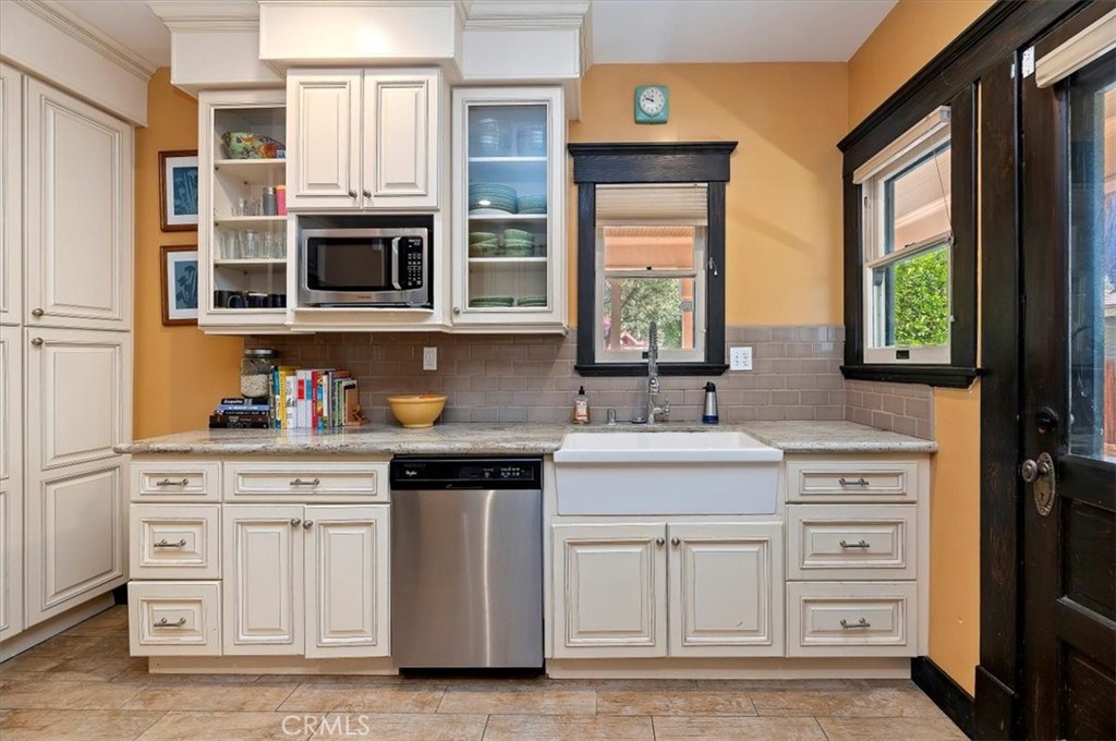 4161 University Riverside, CA 92501 - Photo 22 of 53 a kitchen with stainless steel appliances granite countertop a stove a sink and a microwave