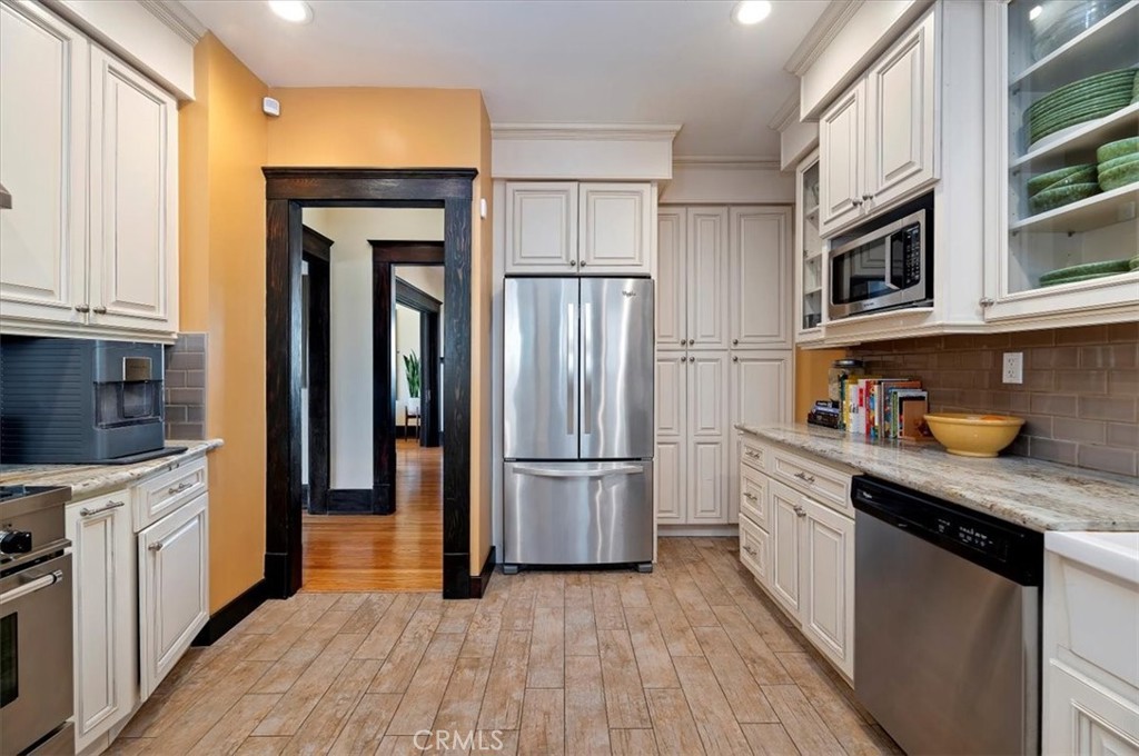 4161 University Riverside, CA 92501 - Photo 24 of 53 a kitchen with stainless steel appliances granite countertop a refrigerator a stove and a sink