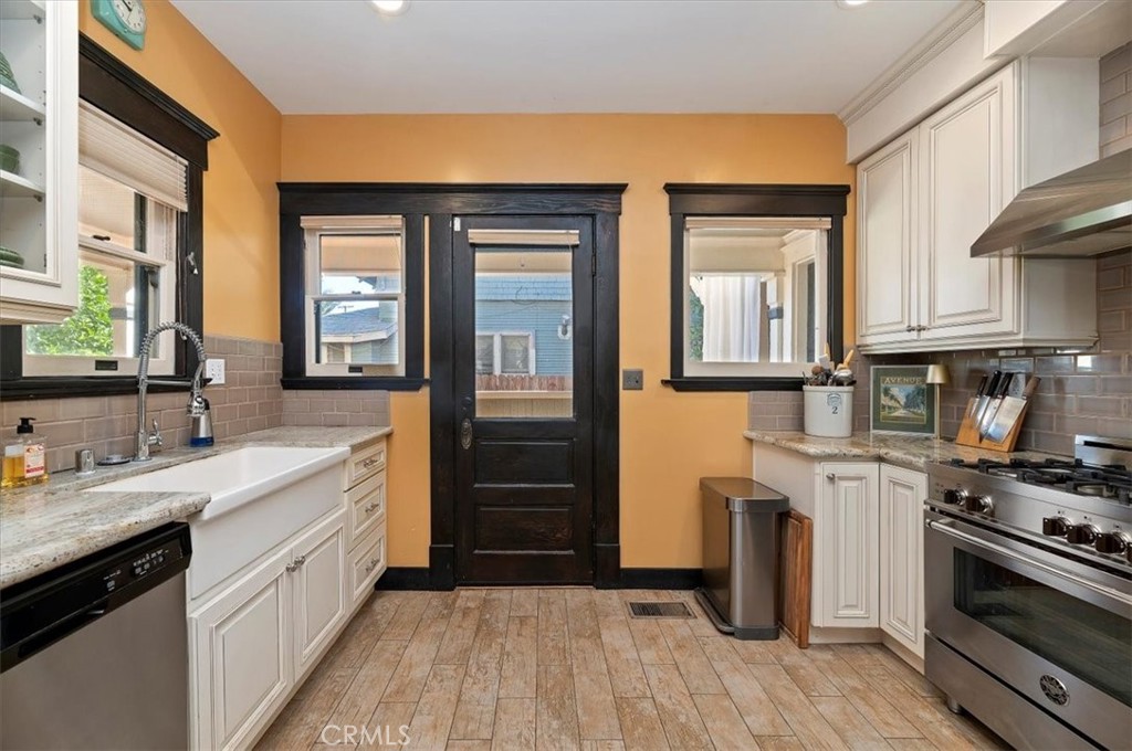 4161 University Riverside, CA 92501 - Photo 25 of 53 a kitchen with a sink and a stove top oven