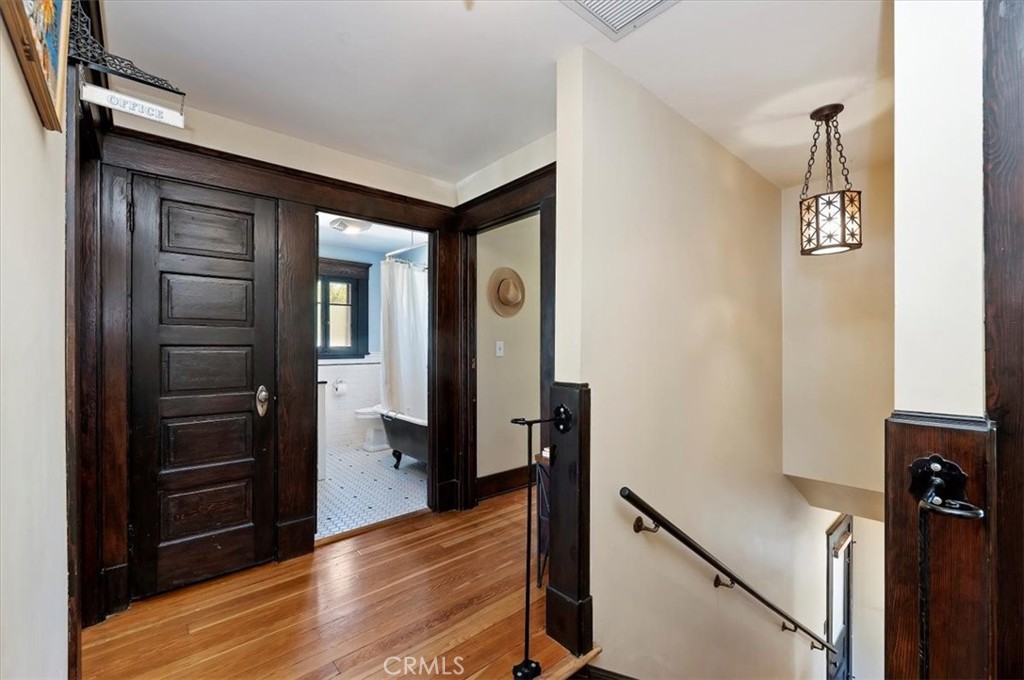 4161 University Riverside, CA 92501 - Photo 31 of 53 a view of a hallway with wooden floor and staircase