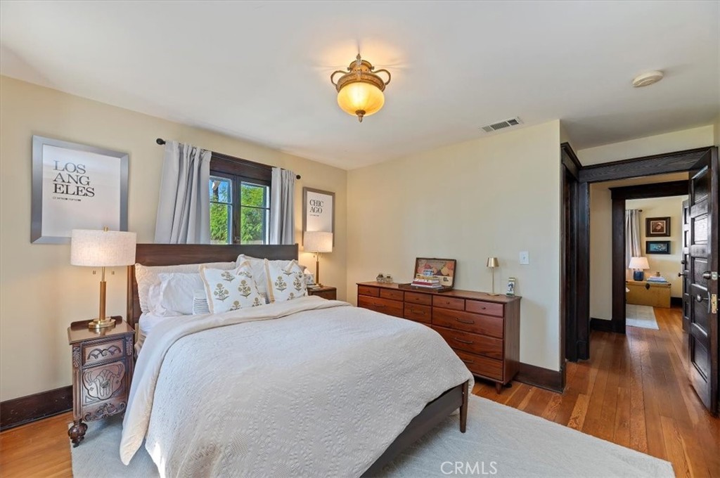 4161 University Riverside, CA 92501 - Photo 32 of 52 a bedroom with a bed and a lamp on table