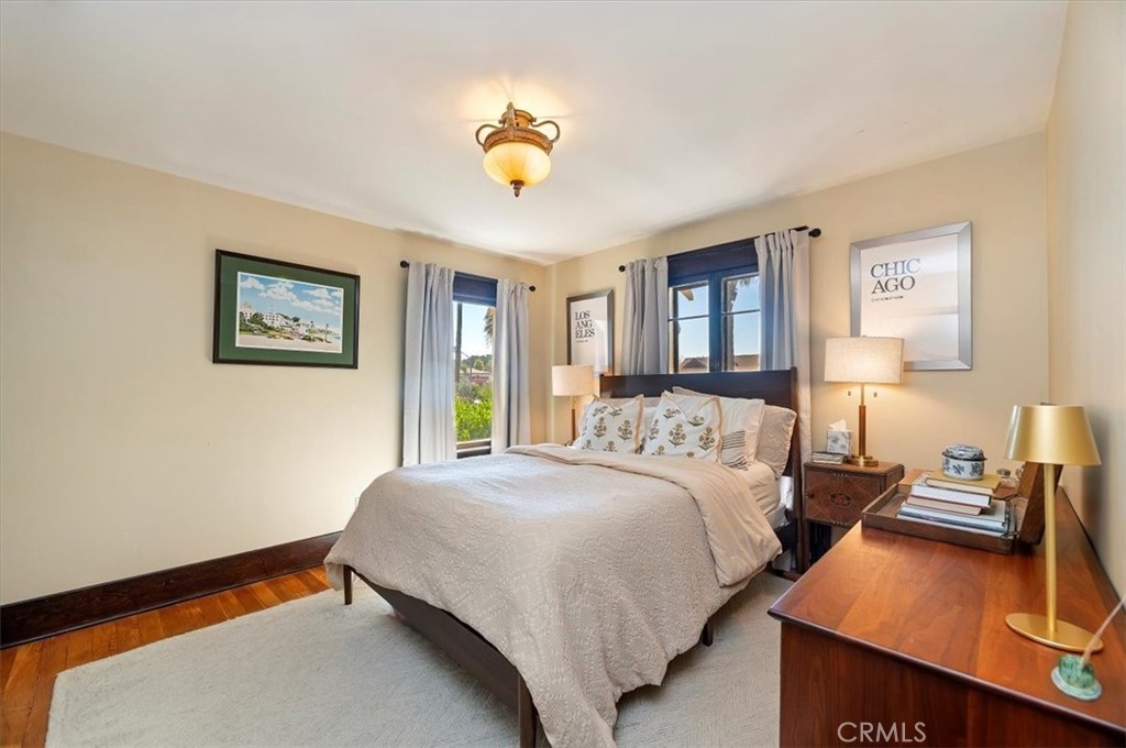 4161 University Riverside, CA 92501 - Photo 32 of 53 a bedroom with a bed and a chandelier