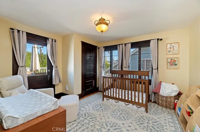 a bedroom with furniture and a window