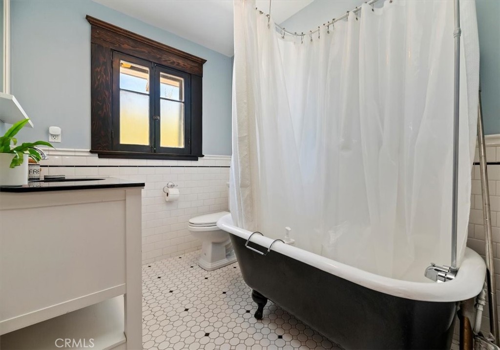 4161 University Riverside, CA 92501 - Photo 39 of 53 a bathroom with a sink a toilet and a window