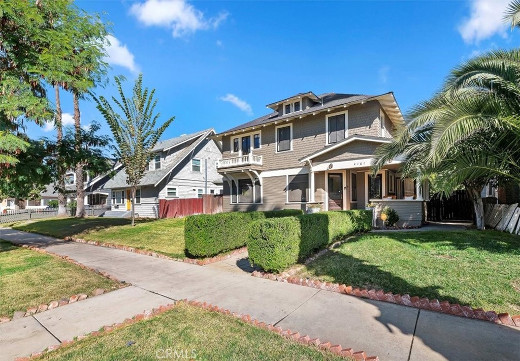 4161 University Riverside, CA 92501 - Photo 4 of 52 a front view of a house with a garden