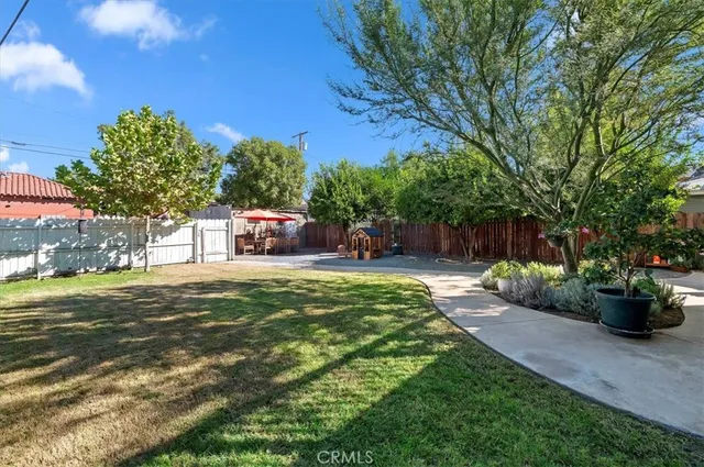 a view of a backyard with patio
