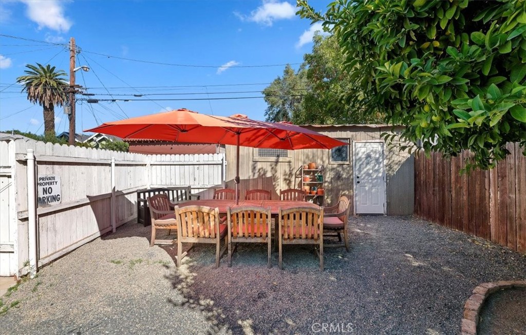 4161 University Riverside, CA 92501 - Photo 47 of 53 a view of a patio with a table and chairs under an umbrella