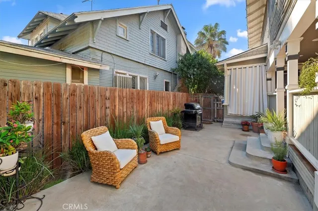 a backyard of a house with outdoor seating