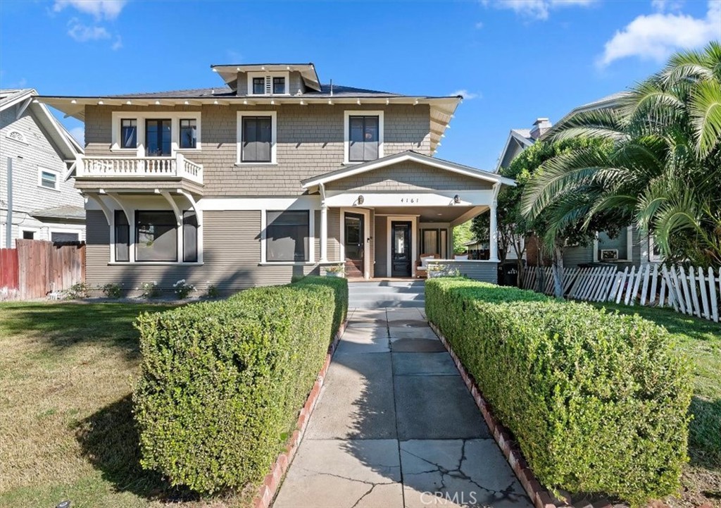 4161 University Riverside, CA 92501 - Photo 5 of 52 a front view of a house with a garden