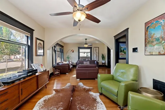 a living room with furniture fireplace and flat screen tv