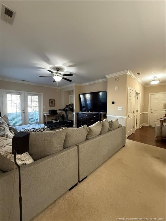 321 Gallery Drive, Unit 203 203 Spring Lake, NC 28390 - Photo 11 of 25 a living room with furniture and a flat screen tv