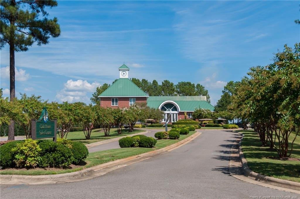 321 Gallery Drive, Unit 203 203 Spring Lake, NC 28390 - Photo 21 of 25 a front view of a house with a yard and outdoor seating