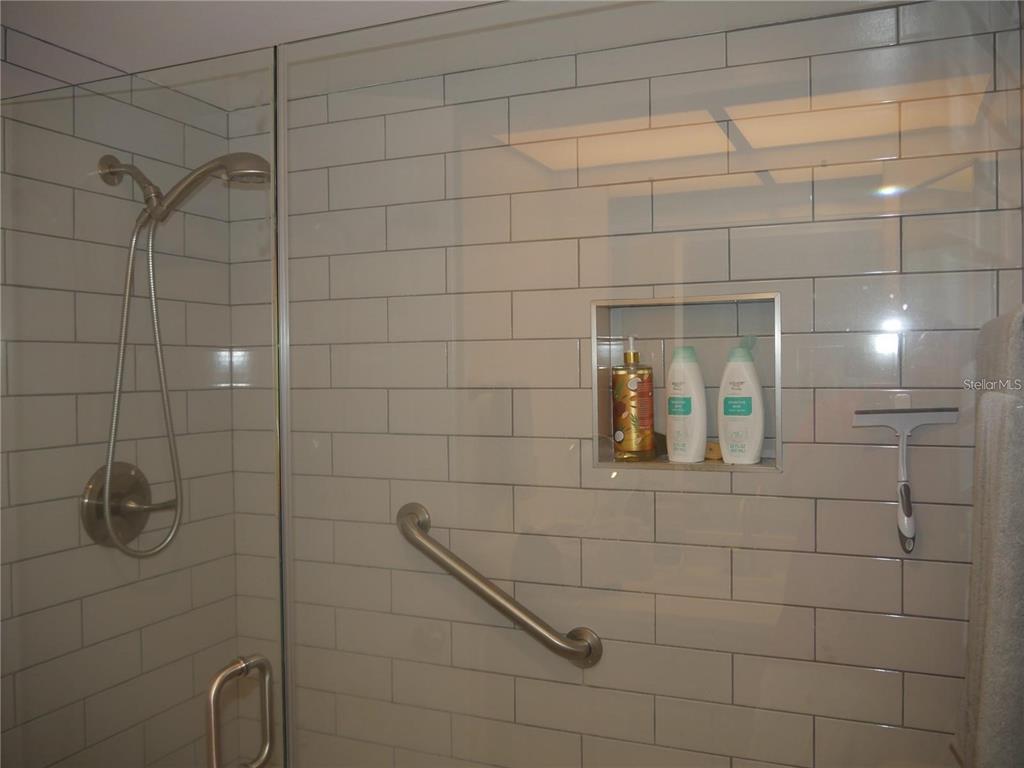 6165 Chesham Drive, Unit 5 New Port Richey, FL 34653 - Photo 15 of 35 a bathroom with a shower