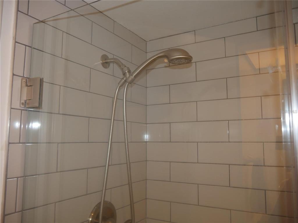 6165 Chesham Drive, Unit 5 New Port Richey, FL 34653 - Photo 19 of 35 a bathroom with a shower