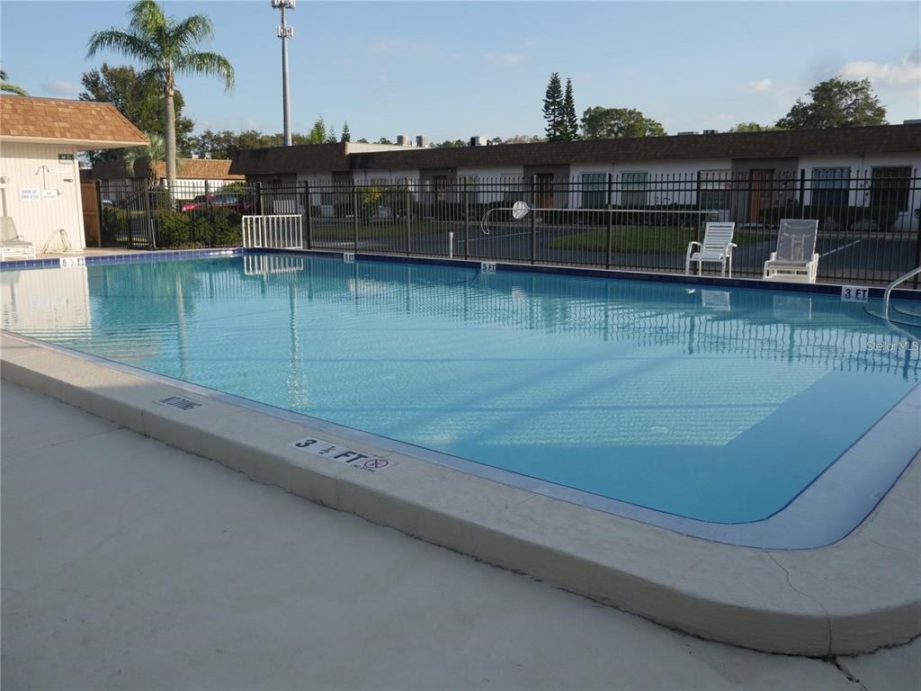 6165 Chesham Drive, Unit 5 New Port Richey, FL 34653 - Photo 34 of 35 a view of a swimming pool