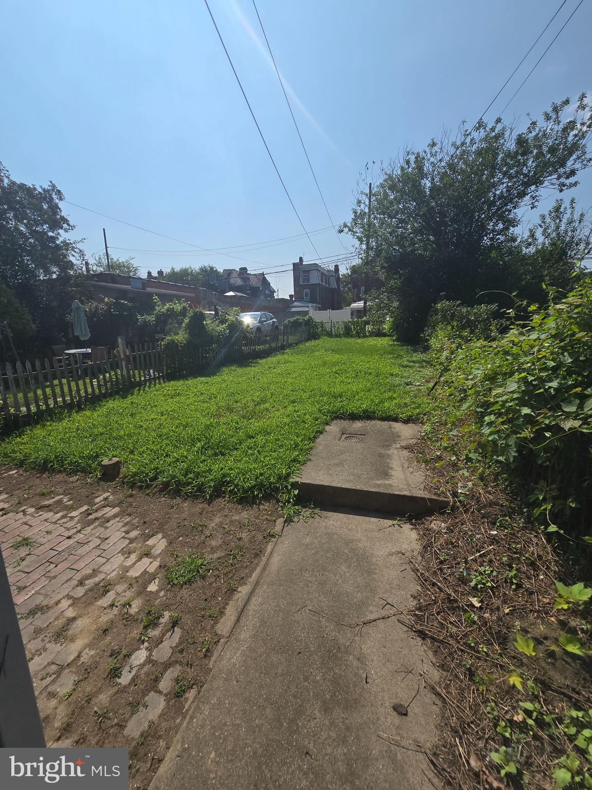 2118 Ruffner Street Philadelphia, PA 19140 - Photo 12 of 14 a view of a street with a houses in the background
