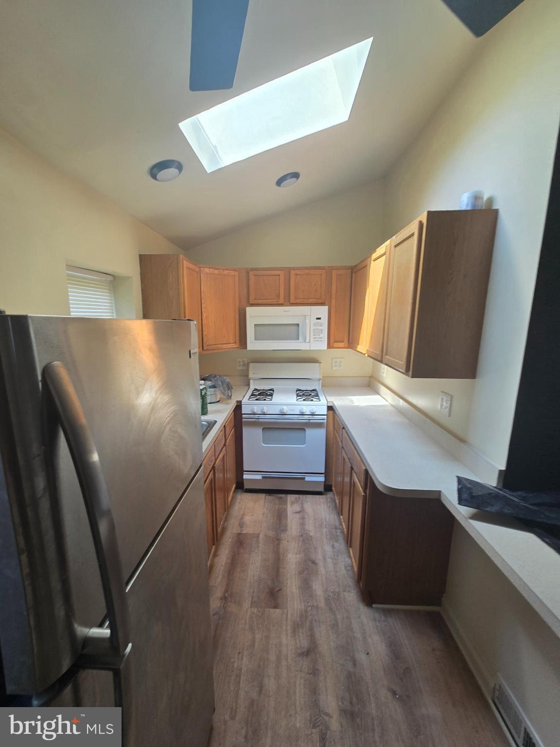 2118 Ruffner Street Philadelphia, PA 19140 - Photo 7 of 14 a kitchen with stainless steel appliances a refrigerator and a stove