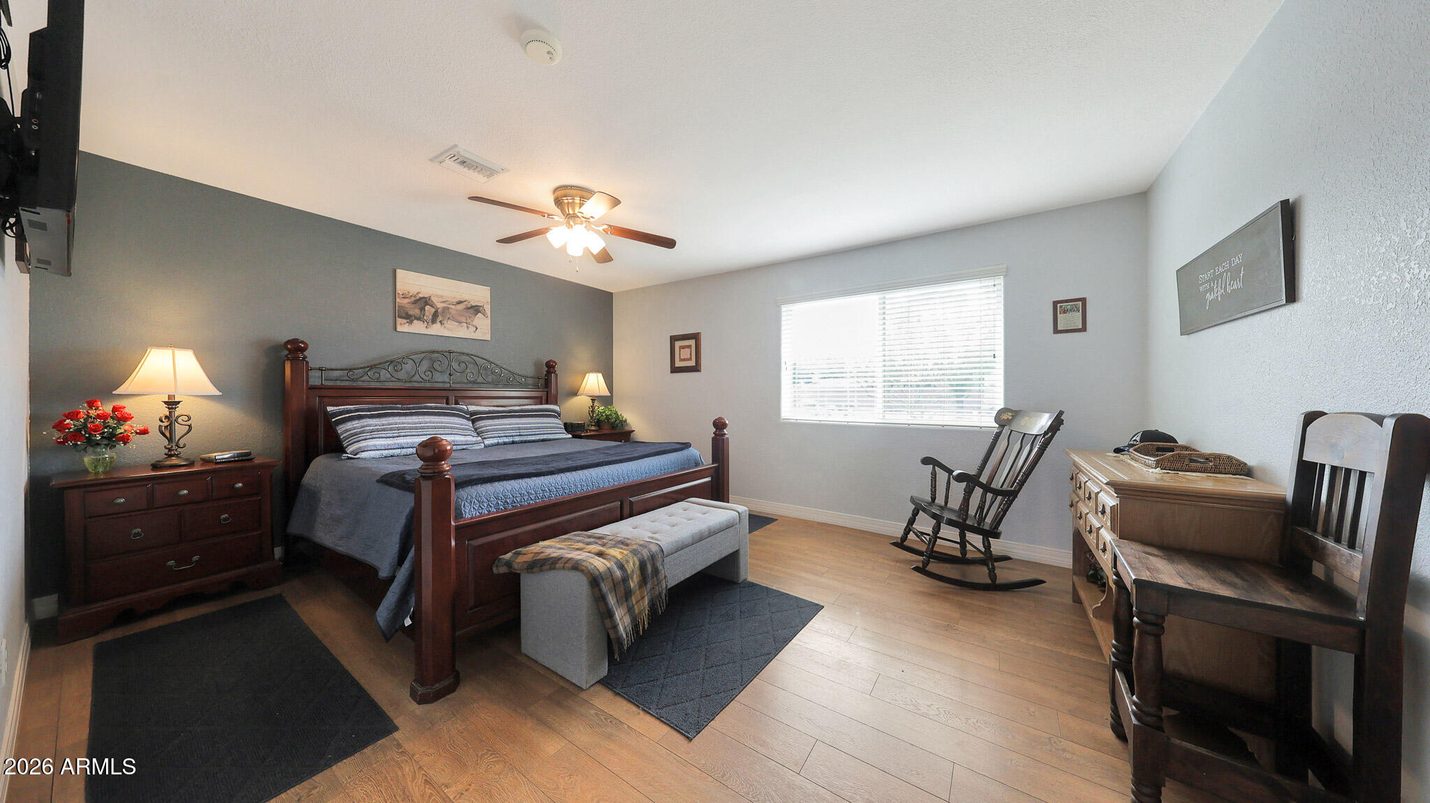8120 West Williams Road Peoria, AZ 85383 - Photo 16 of 46 a bedroom with a bed and a chandelier