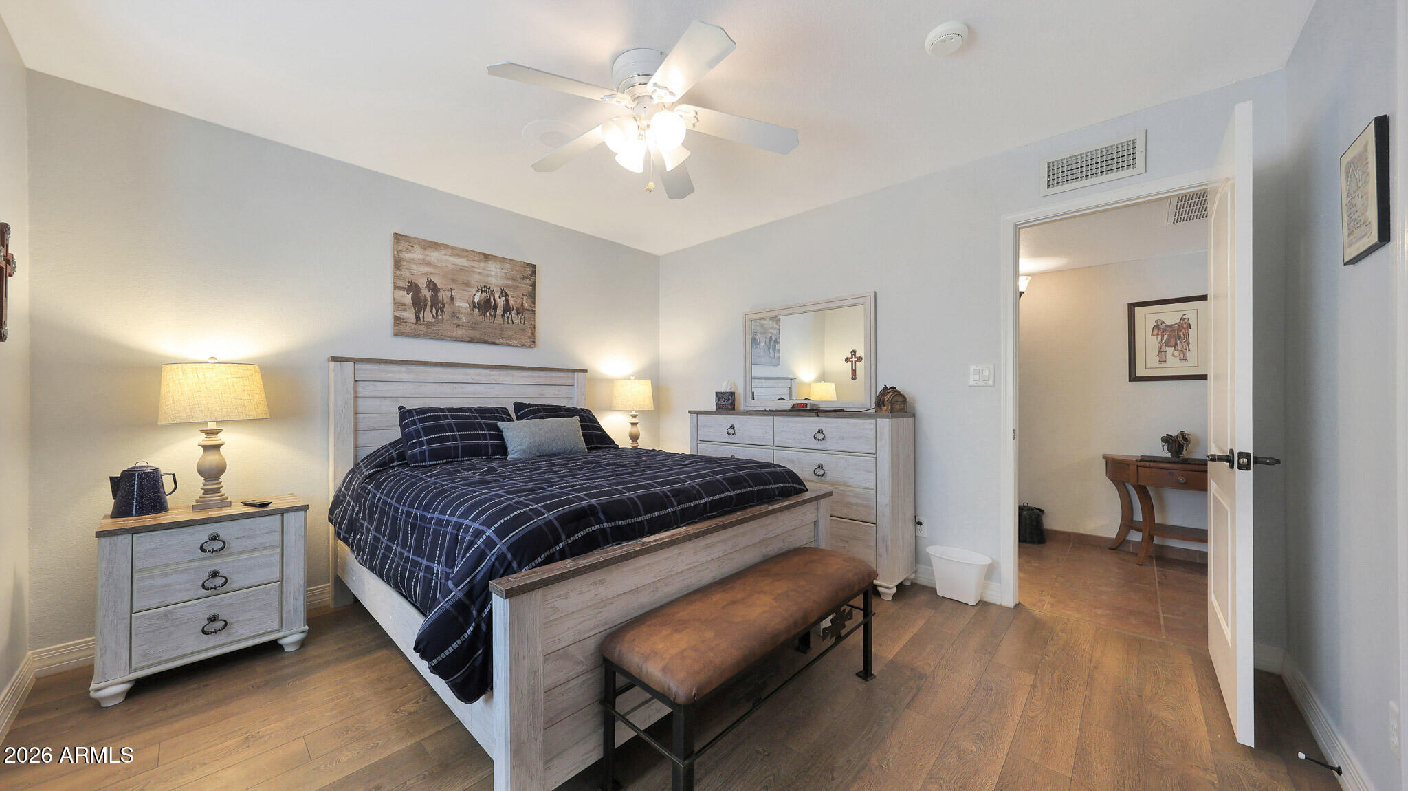 8120 West Williams Road Peoria, AZ 85383 - Photo 22 of 46 a bedroom with a bed and a chandelier