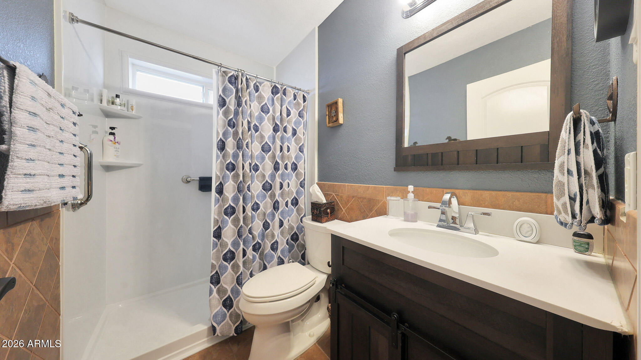 8120 West Williams Road Peoria, AZ 85383 - Photo 23 of 46 a bathroom with a sink and a mirror
