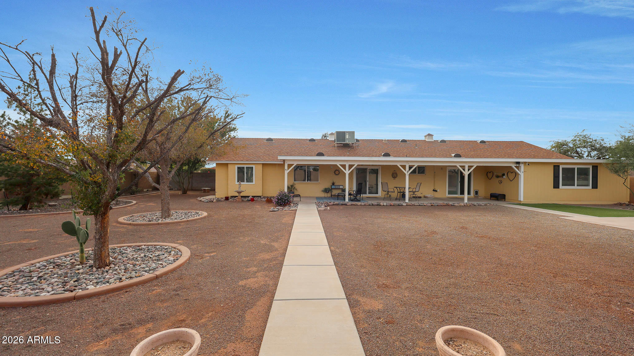 8120 West Williams Road Peoria, AZ 85383 - Photo 28 of 46 a front view of a house with a yard