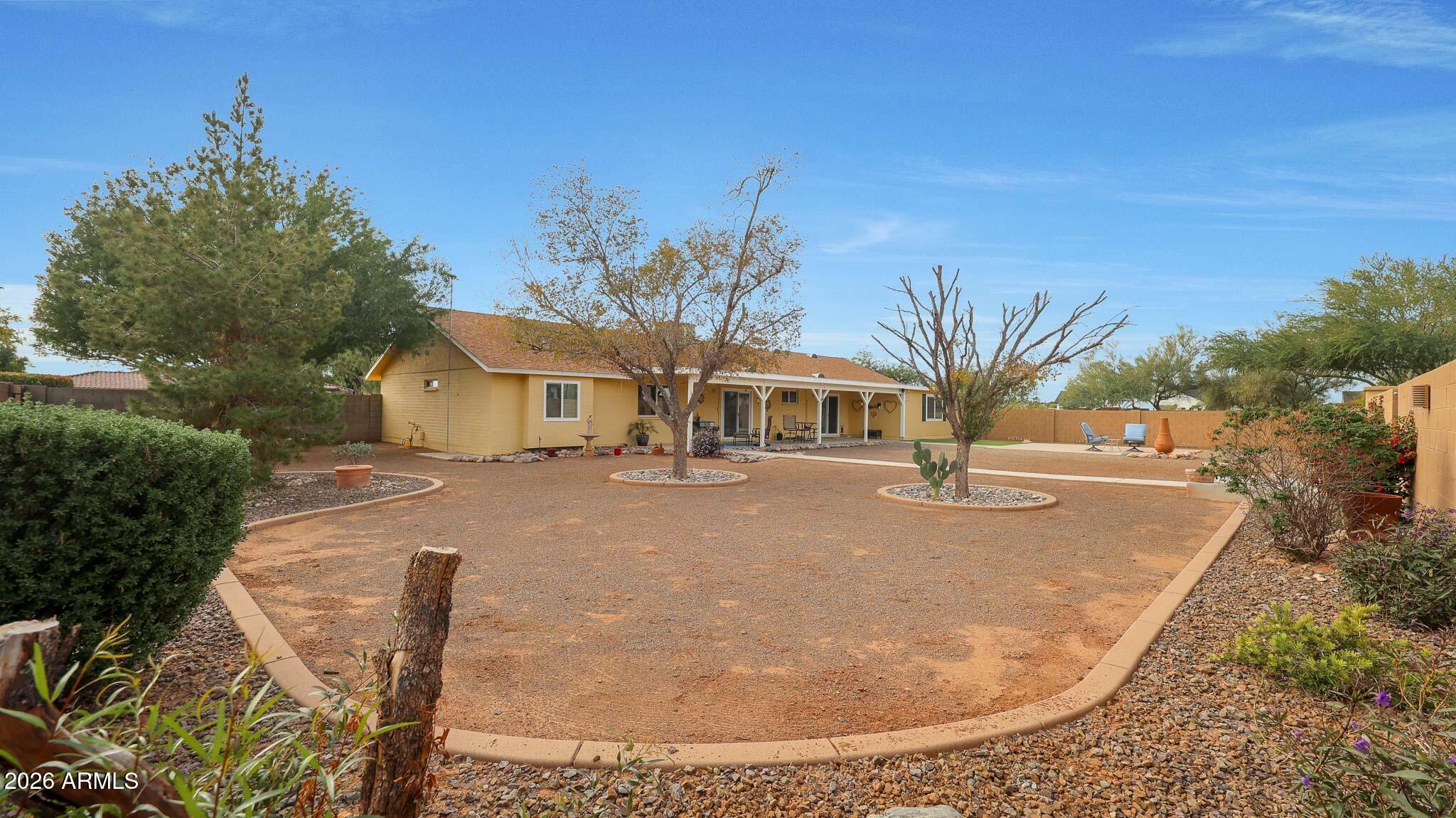 8120 West Williams Road Peoria, AZ 85383 - Photo 29 of 46 a front view of a house with a yard