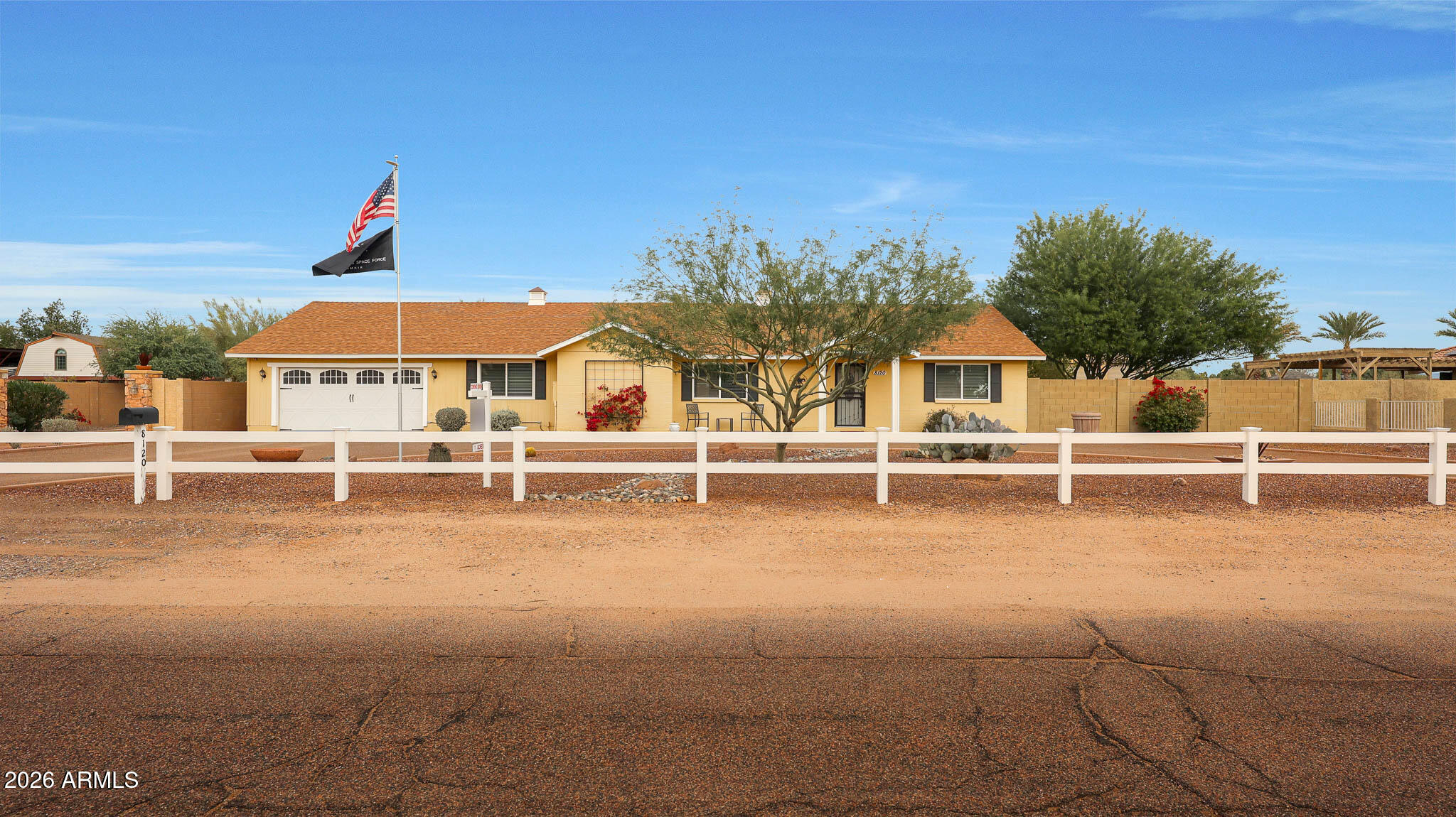 8120 West Williams Road Peoria, AZ 85383 - Photo 3 of 46 a view of a white house with a sink and yard